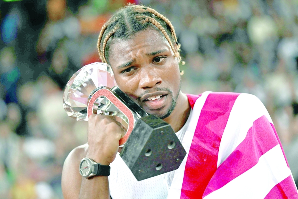 US athlete Noah Lyles celebrates after victory in the men's 100m final during the Diamond League athletics meeting at Stadion Letzigrund stadium in Zurich on September 8, 2022. (Photo by Fabrice COFFRINI / AFP)

