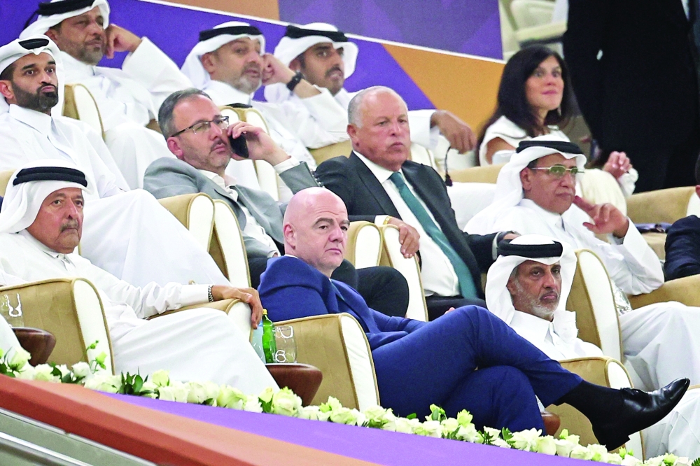 Fifa President Gianni Infantino (C) attends the Lusail Super Cup football match between Saudi Arabia's Al Hilal and Egypt's Zamalek at the Lusail Stadium on the outskirts of Qatar's capital Doha on September 9, 2022.  (Photo by KARIM JAAFAR / AFP)