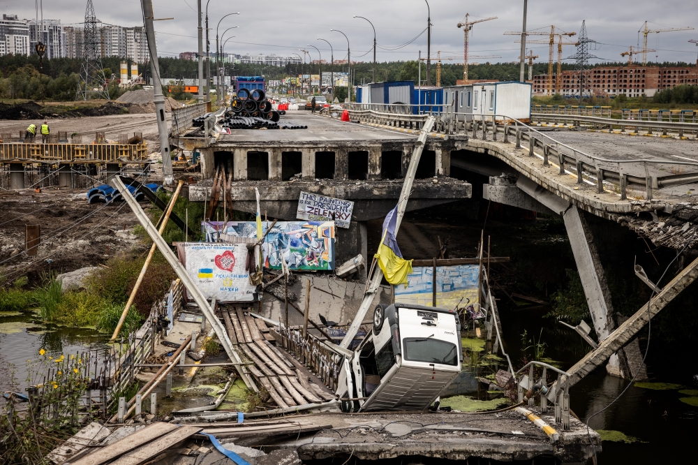 A damaged bridge over the Irpin River in Irpin, Ukraine, on Sunday, Sept. 11, 2022. (Jim Huylebroek/The New York Times)