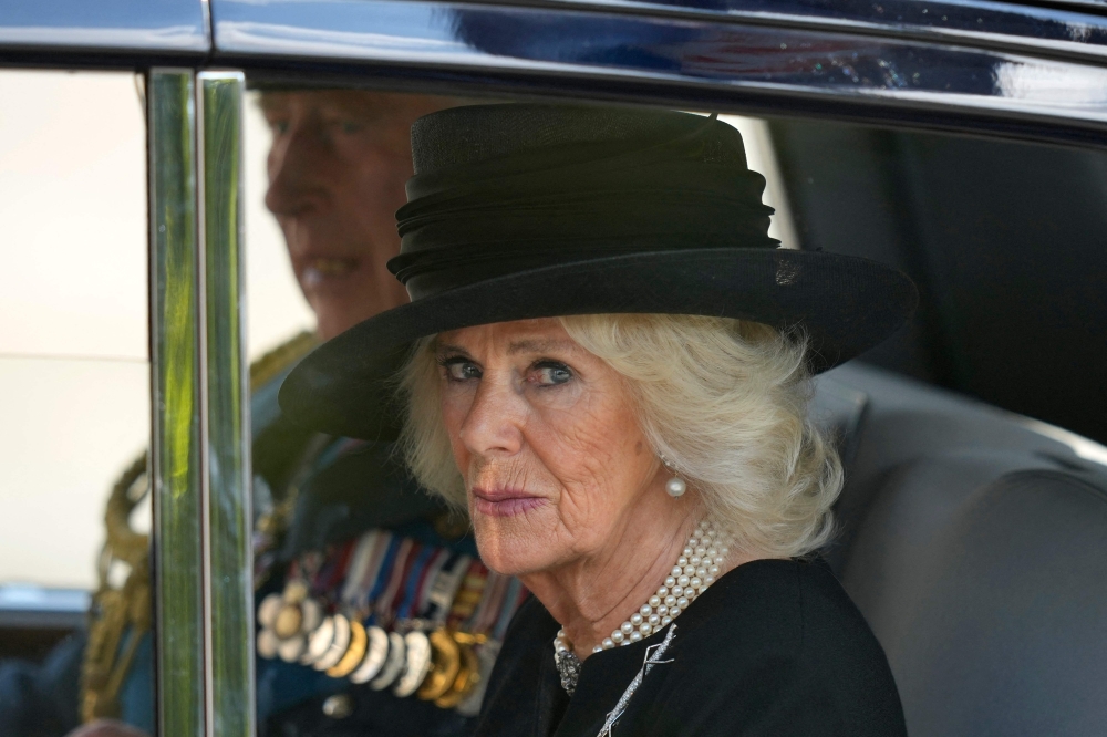 Britain's King Charles III and Camilla, Queen Consort leave Westminster Hall, at the Palace of Westminster in London. - AFP