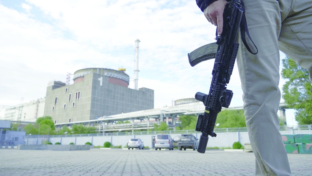 A security person standing in front of the Zaporizhzhia Nuclear Power Plant in Enerhodar (Energodar), Zaporizhzhia Oblast, amid the ongoing Russian military action in Ukraine. — AFP