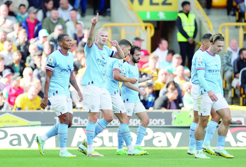 Soccer Football - Premier League - Wolverhampton Wanderers v Manchester City - Molineux Stadium, Wolverhampton, Britain - September 17, 2022 Manchester City's Erling Braut Haaland celebrates scoring their second goal with Manuel Akanji, Jack Grealish, Ruben Dias and Bernardo Silva Action Images via Reuters/Carl Recine EDITORIAL USE ONLY. No use with unauthorized audio, video, data, fixture lists, club/league logos or 'live' services. Online in-match use limited to 75 images, no video emulation. No use in betting, games or single club /league/player publications.  Please contact your account representative for further details.
