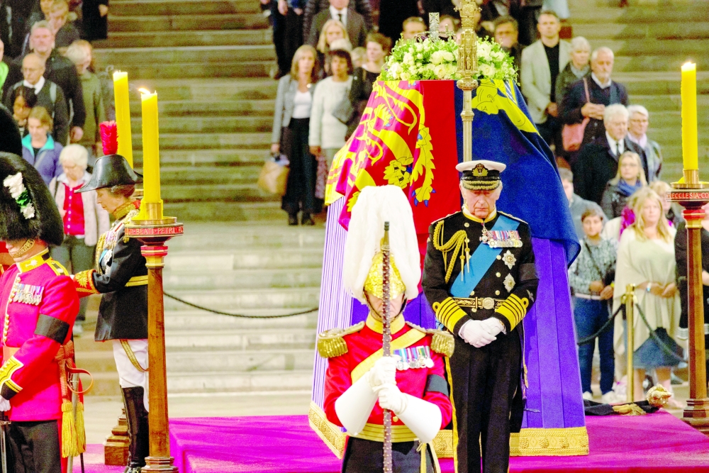 Britain's King Charles and Britain's Anne, Princess Royal, attend a vigil as people pay their respects to the coffin of Britain's Queen Elizabeth inside Westminster Hall in London. - Reuters