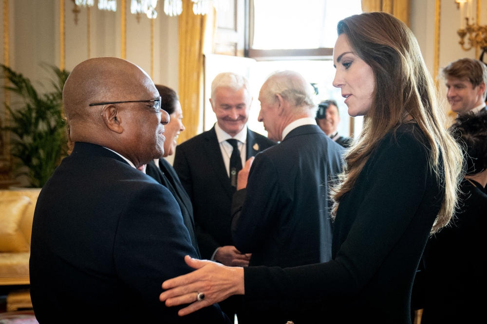 Britain's Catherine, Princess of Wales speaks to Cyril Errol Melchiades Charles, Governor of Saint Lucia