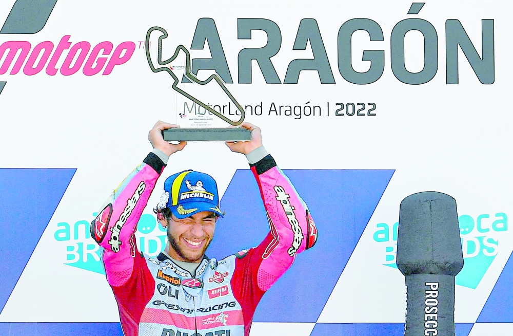 Ducati Gresini Italian rider Enea Bastianini holds the trophy after winning the Moto Grand Prix GP of Aragon at the Motorland circuit in Alcaniz on September 18, 2022.  (Photo by Pau BARRENA / AFP)

