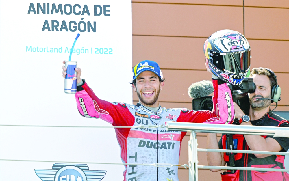 Ducati Gresini Italian rider Enea Bastianini celebrates after winning the Moto Grand Prix GP of Aragon at the Motorland circuit in Alcaniz on September 18, 2022.  (Photo by Pierre-Philippe MARCOU / AFP)


