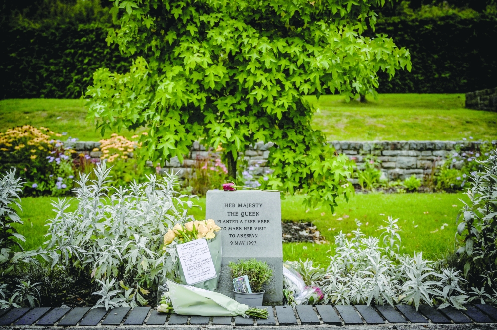 Tributes in memory of Queen Elizabeth II in the Aberfan Memorial Garden, in the Welsh community that the queen visited four times after an avalanche of coal slurry in October 1966 killed 116 children and 28 adults.
