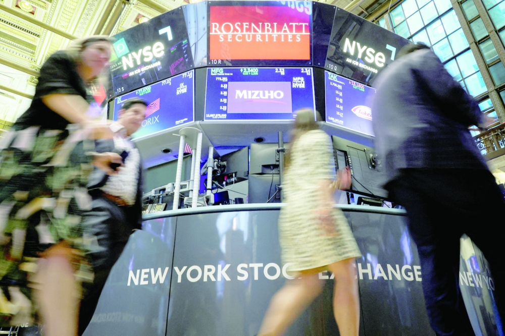 Guests walk on the floor of the New York Stock Exchange. MSCI's world stocks index fell to its lowest since mid-2020 on Friday, having lost about 12% in the month or so since Fed Chair Jerome Powell made clear that bringing down inflation would hurt. -- Reuters