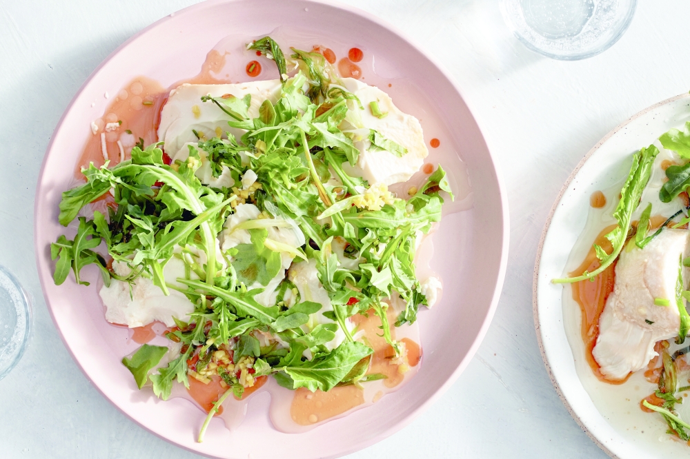 Kay Chun’s tofu with sizzling scallion oil which takes only 15 minutes to make and delivers a sizzled garlic-ginger-scallion sauce you can use to douse silken tofu. (Johnny Miller/The New York Times)