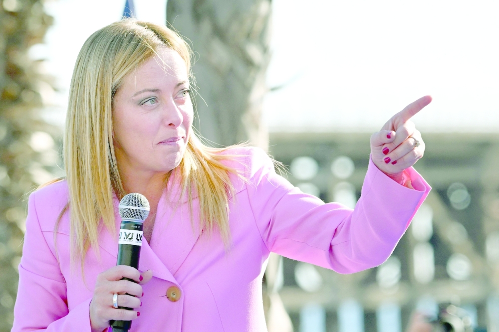 Leader of Italian far-right party Fratelli d'Italia (Brothers of Italy), Giorgia Meloni, delivers a speech at the Arenile di Bagnoli beachfront location in Naples on Friday. -- AFP
