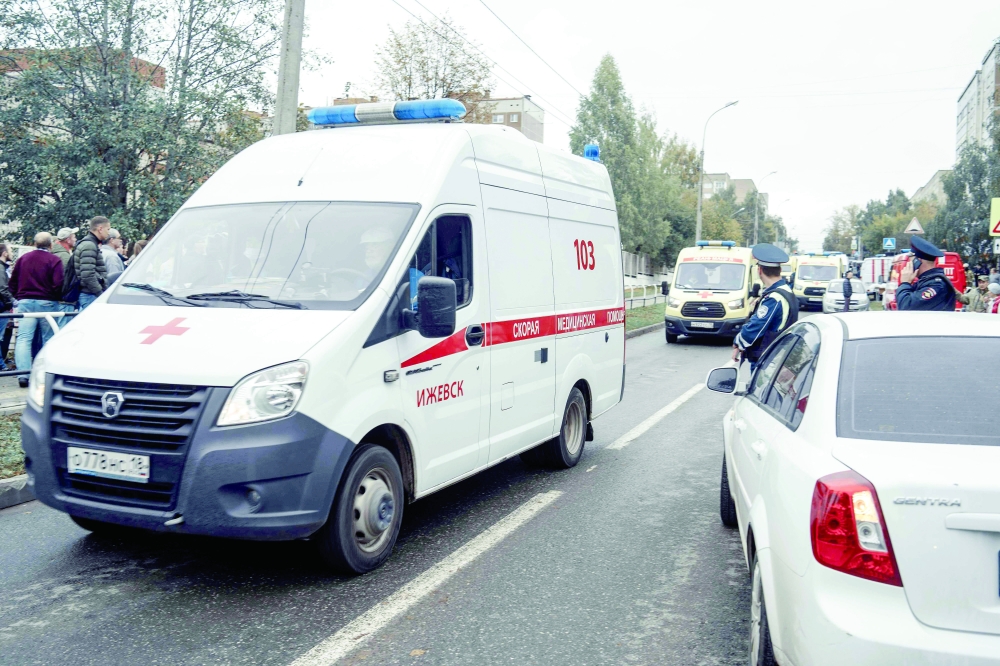 Ambulances move on a road near the scene of a shooting in school No88 in Izhevsk. - AFP 