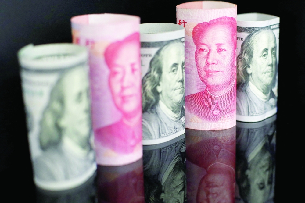 Banknotes of Chinese yuan and US dollar are seen in this illustration picture. -- Reuters