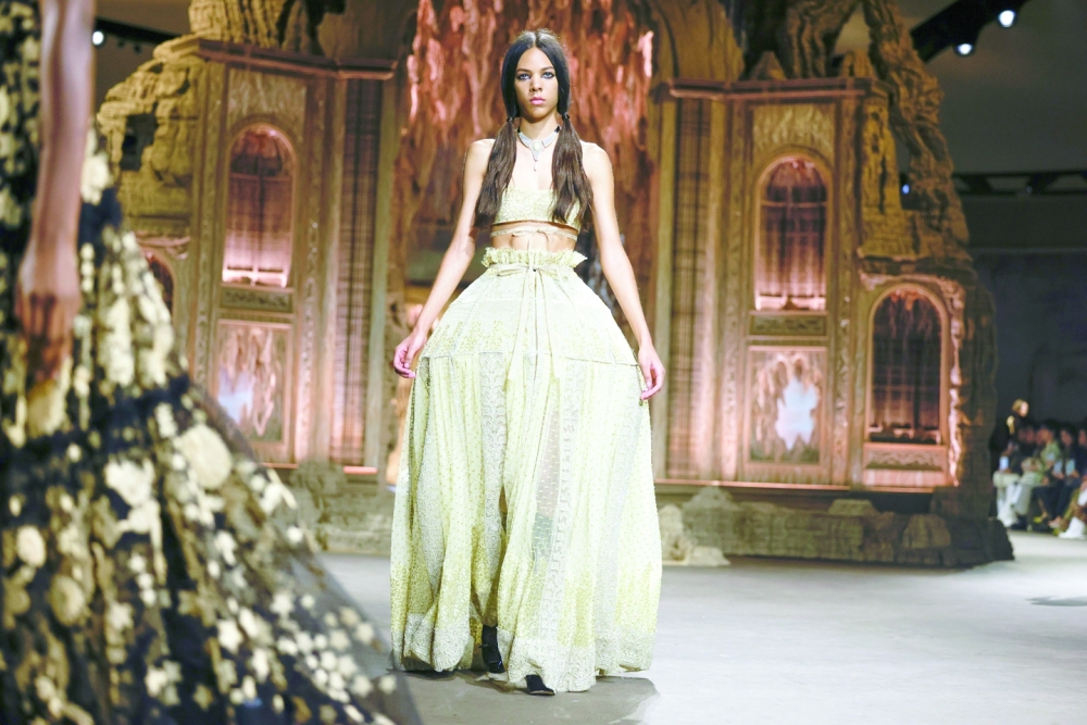 A model presents a look at the Dior spring 2023 fashion show in Paris, Sept. 27, 2022. (Valerio Mezzanotti/The New York Times)