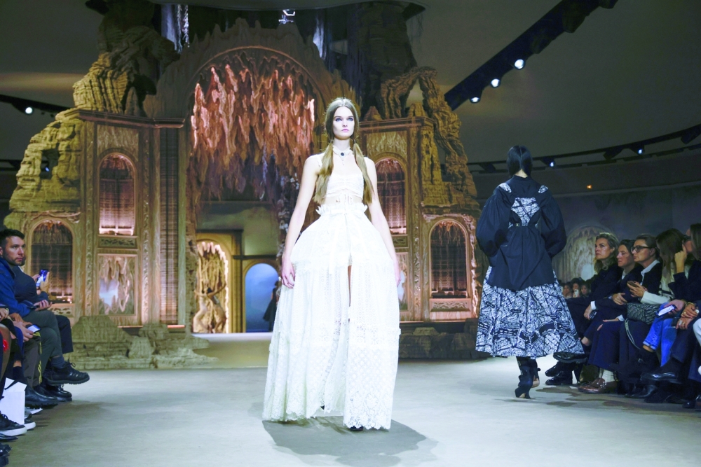 A model presents a look at the Dior spring 2023 fashion show in Paris, Sept. 27, 2022. (Valerio Mezzanotti/The New York Times)