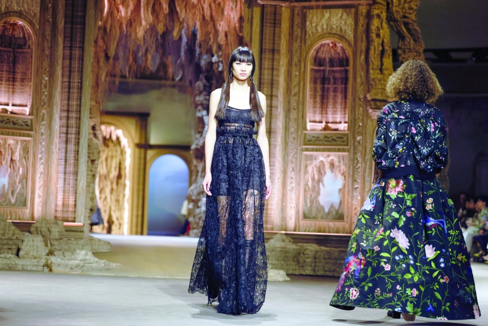 A model presents a look at the Dior spring 2023 fashion show in Paris, Sept. 27, 2022. (Valerio Mezzanotti/The New York Times)
