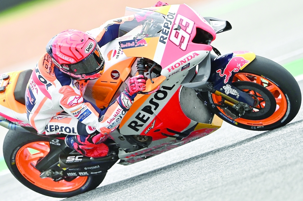 TOPSHOT - Repsol Honda Team rider Marc Marquez of Spain rides his bike during the first free practice session of the MotoGP Thailand Grand Prix at Buriram International Circuit in Buriram on September 30, 2022. (Photo by MANAN VATSYAYANA / AFP)

