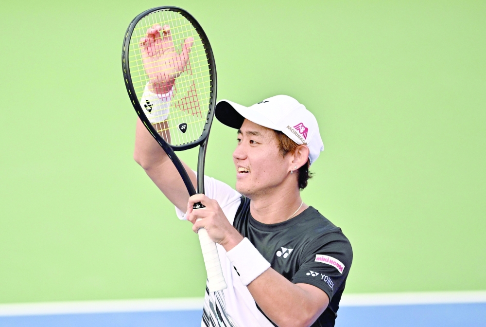 Yoshihito Nishioka of Japan celebrates his victory after the men's singles match against Casper Ruud of Norway at the Korea Open Tennis Championships in Seoul on September 30, 2022. (Photo by Jung Yeon-je / AFP)

