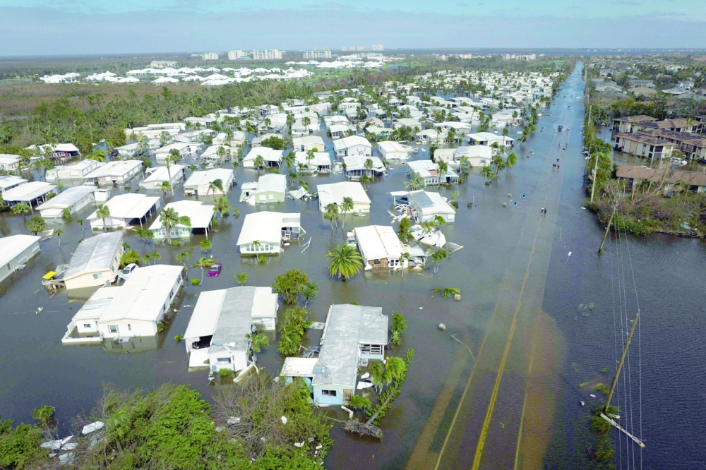 An aerial picture shows a flooded neighbourhood in the aftermath of Hurricane Ian in Fort Myers, Florida. -- AFP