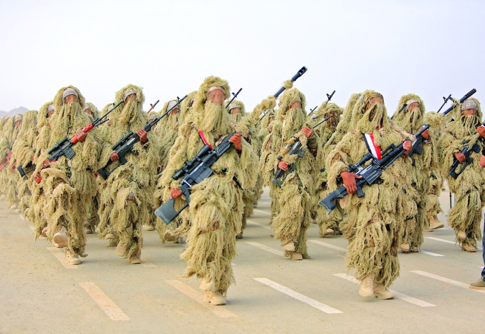Fighters loyal to government take part in a military parade in Marib. -- AFP