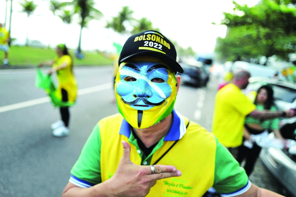 Supporters of Brazil's President Jair Bolsonaro gather outside his home, in Rio de Janeiro. - Reuters
