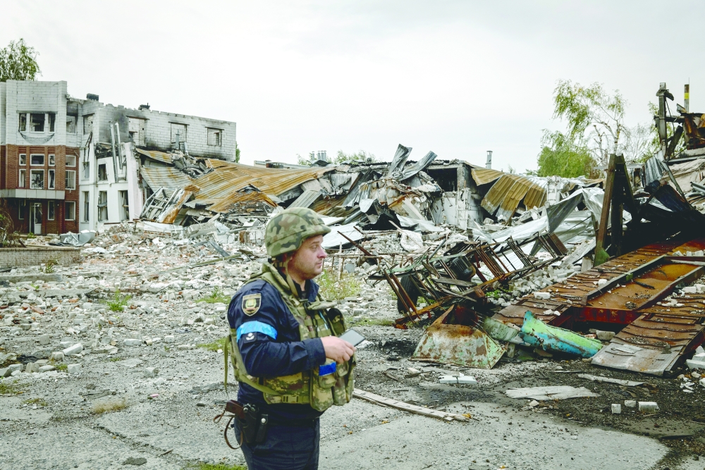A Ukrainian police officer in Lyman after it was recaptured from the Russians.
