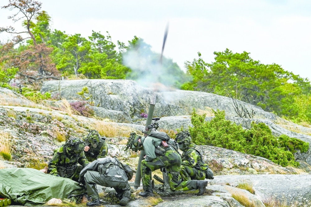 Swedish Marines fire a mortar during joint military exercises with US Marines on the island of Uto, which Russia invaded in 1719.  
