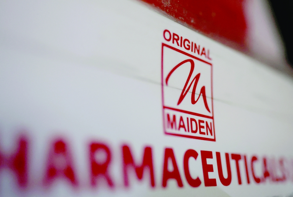 Logo of the Maiden Pharmaceuticals Ltd company is seen on a board outside their office in New Delhi, India, on Thursday. - Reuters