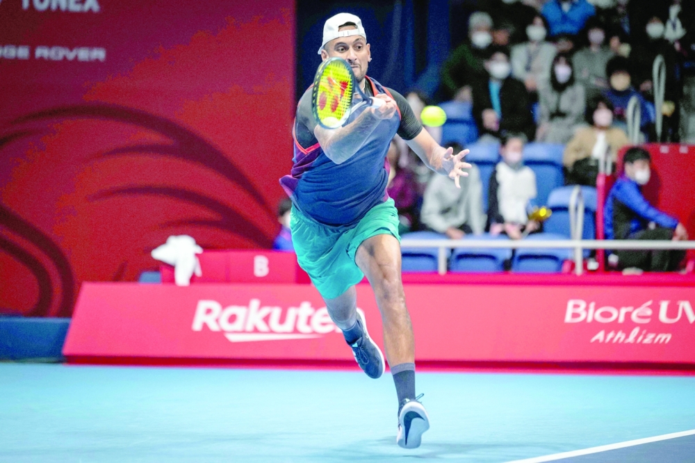 Nick Kyrgios of Australia hits a return against Kamil Majchrzak of Poland during their men's singles match at the Japan Open tennis tournament in Tokyo on October 6, 2022. (Photo by Yuichi YAMAZAKI / AFP)

