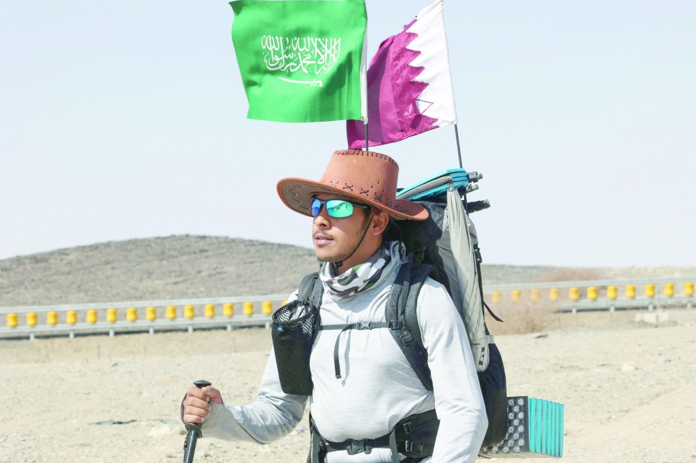 Abdullah Alsulmi crosses a desert area near al Khasrah area, some 350 km west of Riyadh, during his solo trek to the Qatari capital ahead of the Fifa World Cup. — AFP