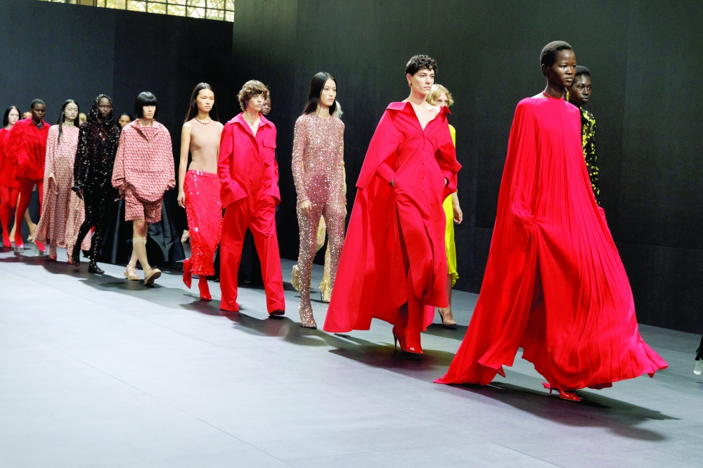 Models present looks at the Valentino spring 2023 fashion show in Paris, Oct. 2, 2022. (Valerio Mezzanotti/The New York Times)