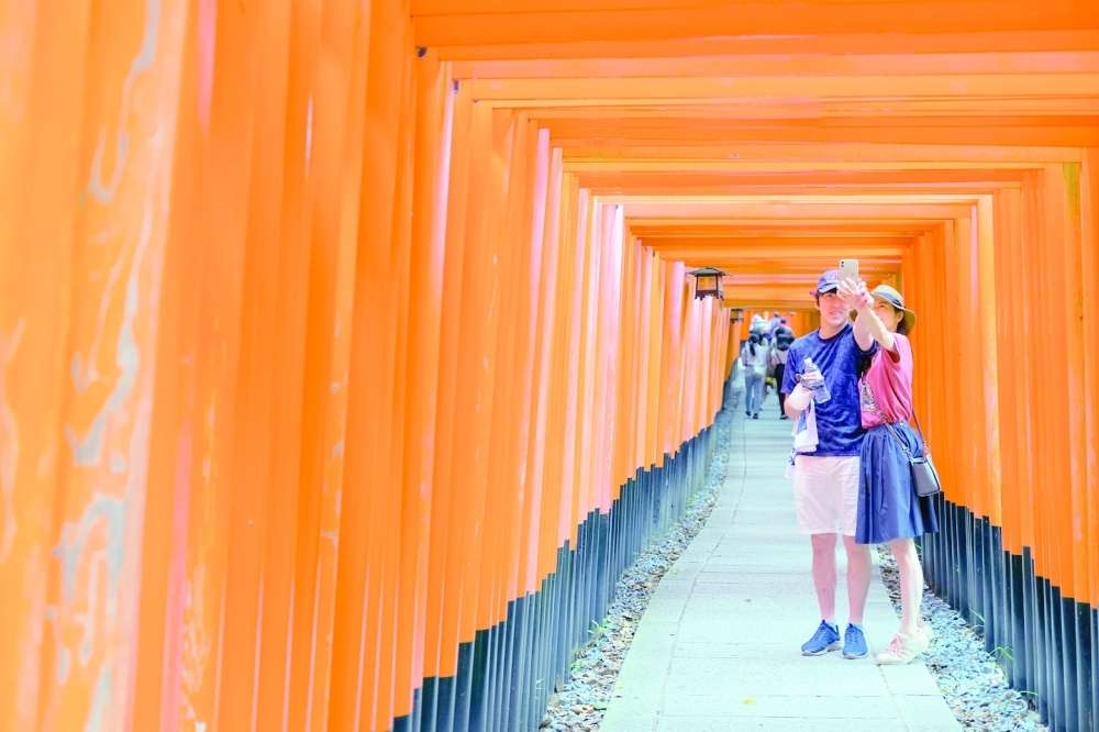 The tori gates at the Fushimi Inari shrine in Kyoto, Japan, on Aug. 28, 2022. (Andrew Faulk/The New York Times)