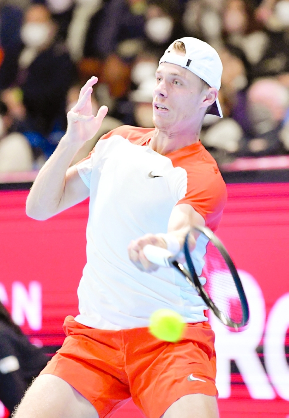 Denis Shapovalov of Canada hits a return against Borna Coric of Croatia during their men's singles quarterfinal match at the Japan Open tennis tournament in Tokyo on October 7, 2022.  (Photo by Kazuhiro NOGI / AFP)