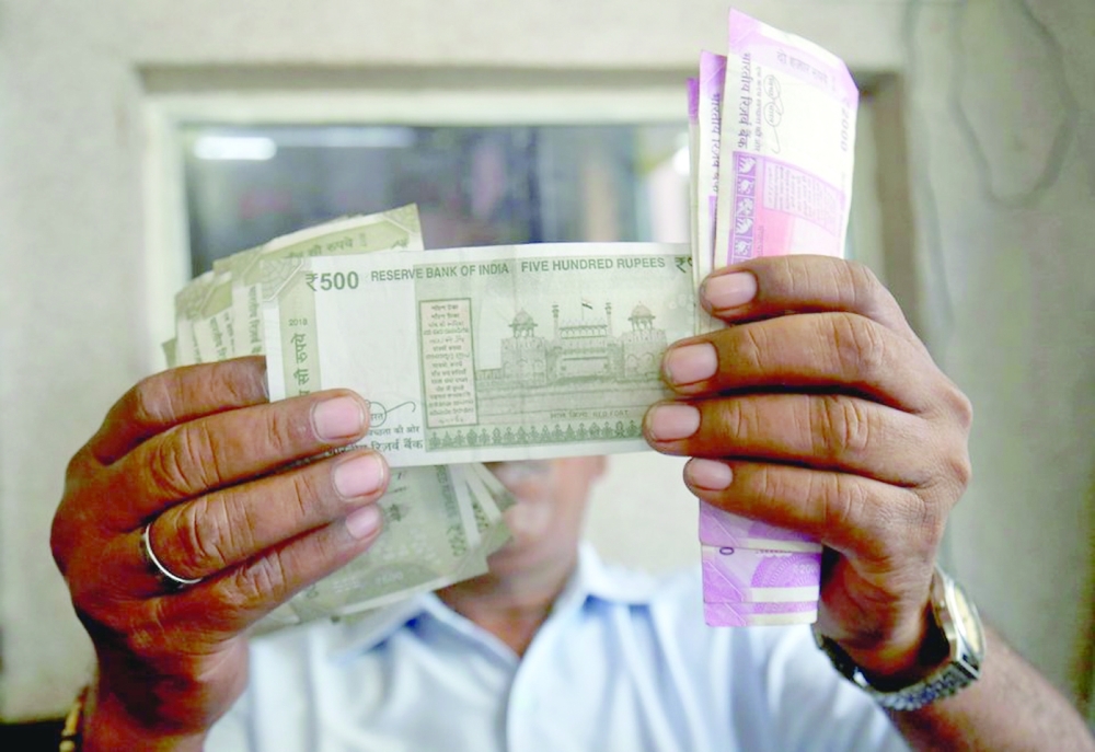 Indian rupee breached the key 82 per dollar level on Friday, having weakened for four straight weeks.