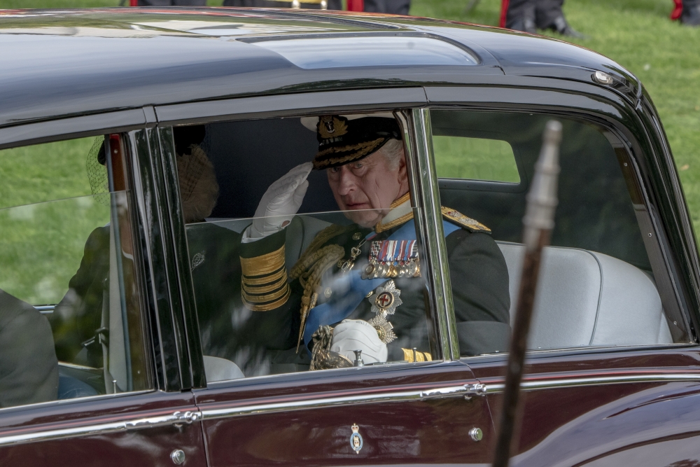 King Charles III and his wife, Camilla, the queen consort, depart Wellington Arch during funeral ceremonies for Queen Elizabeth II in London, Sept. 19, 2022. (Andrew Testa/The New York Times)