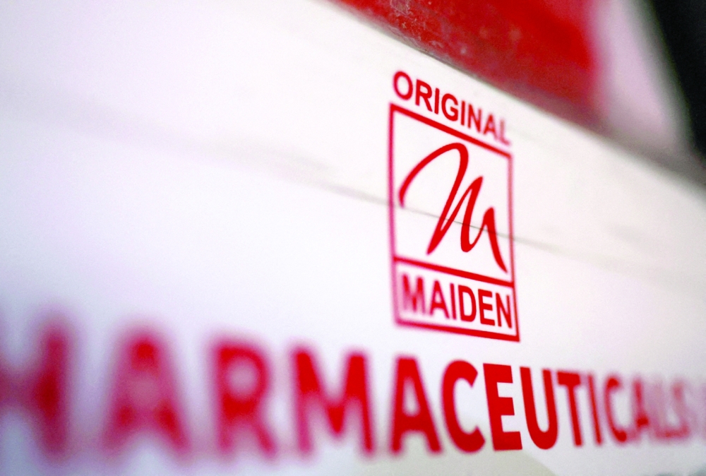 Logo of the Maiden Pharmaceuticals Ltd company on a board outside their office in New Delhi. - Reuters
