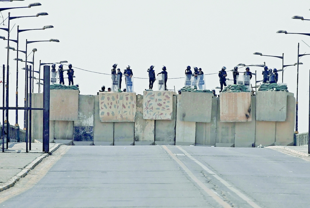 Iraqi security forces block a road leading to the Green Zone in Baghdad on Thursday as lawmakers gather for their fourth attempt this year to elect a new state president. -- AFP