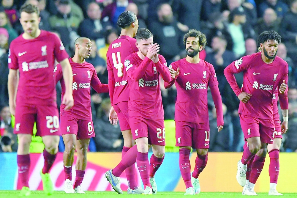 TOPSHOT - Liverpool's Egyptian striker Mohamed Salah (3R) celebrates scoring his team's sixth goal during the UEFA Champions League Group A football match between  Glasgow Rangers and Liverpool at the Ibrox Stadium, in Glasgow, on October 12, 2022. (Photo by ANDY BUCHANAN / AFP)


