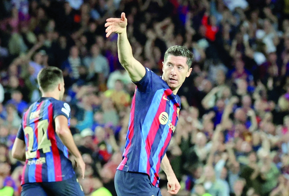 Soccer Football - Champions League - Group C - FC Barcelona v Inter Milan - Camp Nou, Barcelona, Spain - October 12, 2022   FC Barcelona's Robert Lewandowski celebrates scoring their second goal REUTERS/Nacho Doce
