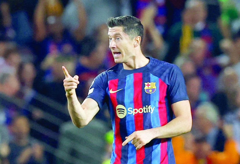 Soccer Football - Champions League - Group C - FC Barcelona v Inter Milan - Camp Nou, Barcelona, Spain - October 12, 2022   FC Barcelona's Robert Lewandowski reacts after scoring their second goal REUTERS/Albert Gea
