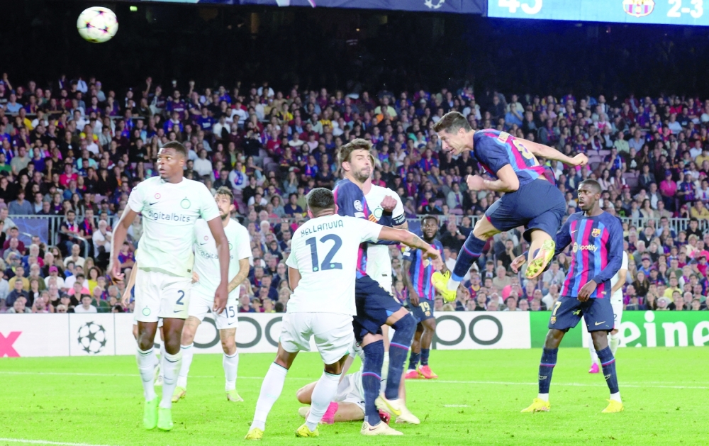 Soccer Football - Champions League - Group C - FC Barcelona v Inter Milan - Camp Nou, Barcelona, Spain - October 12, 2022   FC Barcelona's Robert Lewandowski scores their third goal REUTERS/Nacho Doce