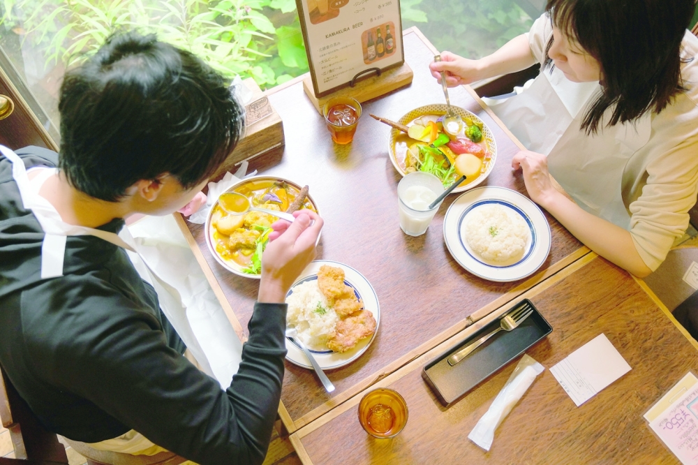 Diners at a location of Rojiura Curry Samurai in Kamakura, Japan. (Andrew Faulk/The New York Times)