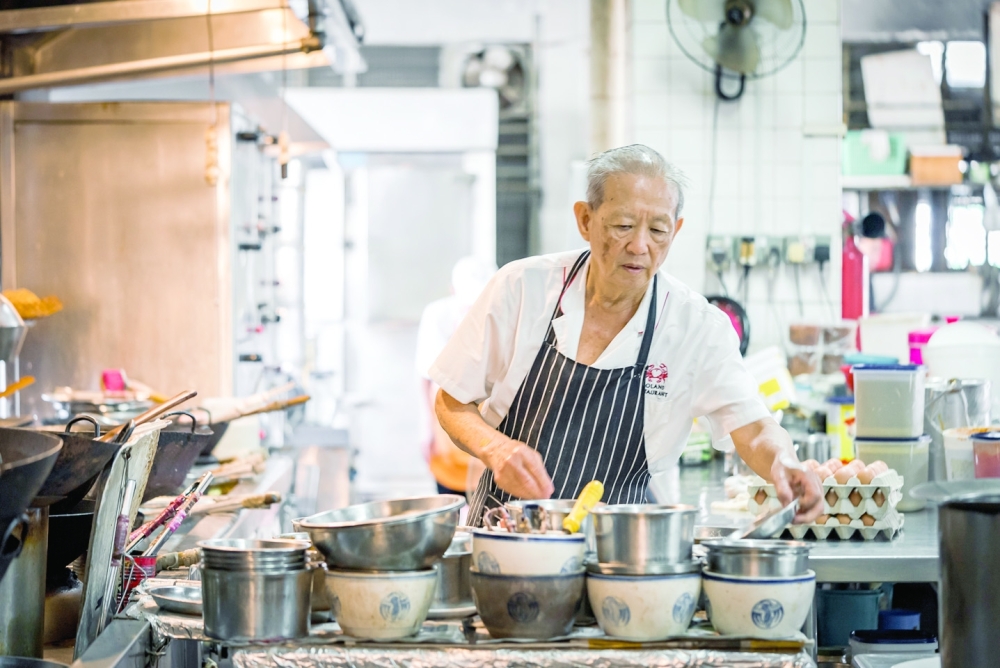 In the kitchen at Roland Restaurant in Singapore. (Lauryn Ishak/The New York Times)