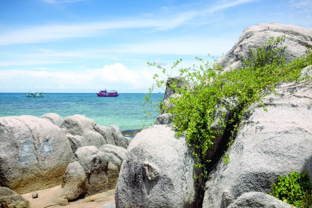 Dive boats sit off Sairee beach in Koh Tao, Thailand, on Sept. 4, 2022. (Jack Taylor/The New York Times)