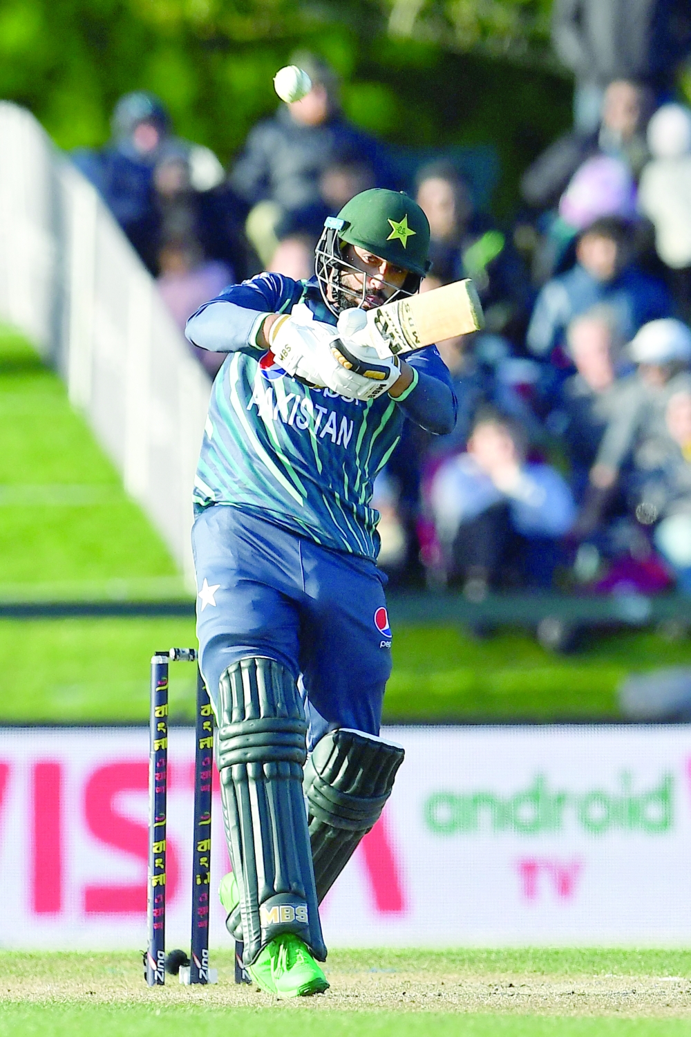 Pakistan's Mohammad Nawaz plays a shot during the Twenty20 tri-series final cricket match between New Zealand and Pakistan at Hagley Oval in Christchurch on October 14, 2022.  (Photo by Sanka Vidanagama / AFP)