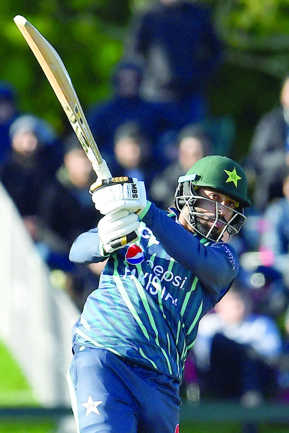 Pakistan's Mohammad Nawaz plays a shot during the Twenty20 tri-series final cricket match between New Zealand and Pakistan at Hagley Oval in Christchurch on October 14, 2022.  (Photo by Sanka Vidanagama / AFP)

