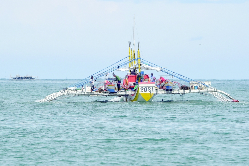 Fishing boat is anchored near the shores of the village of Cato. -- AFP