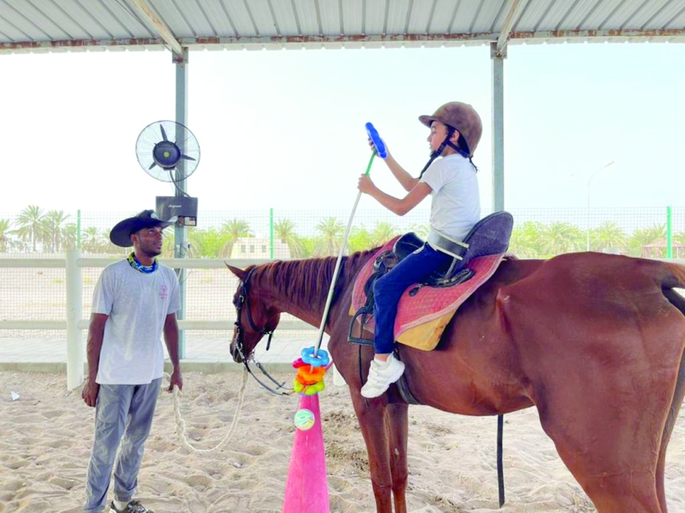 Special children undergoing training in horse ride