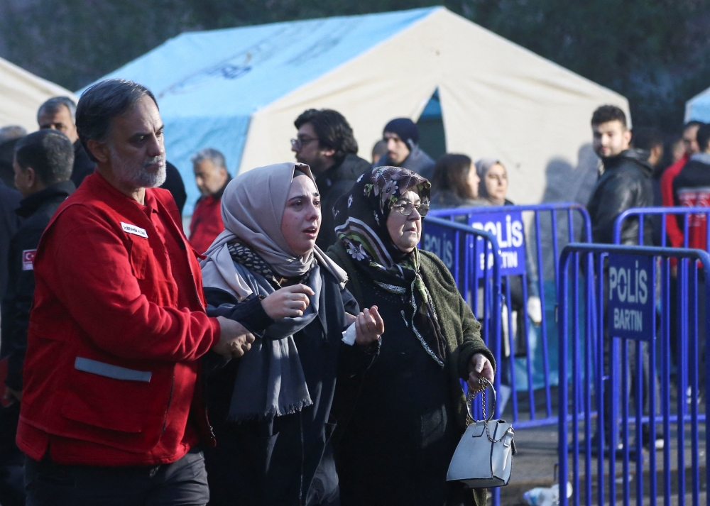Relatives of miners react outside the coal mine as search and rescue operation continues after an explosion, in Amasra in the northern Bartin province, Turkey October 15, 2022. REUTERS/Cagla Gurdogan
