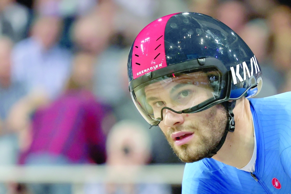 Italy's Filippo Ganna prepares to compete in the Men's Individual Pursuit qualifying during the UCI Track Cycling World Championships at the Velodrome of Saint-Quentin-en-Yvelines, southwest of Paris, on October 14, 2022.  (Photo by Thomas SAMSON / AFP)

