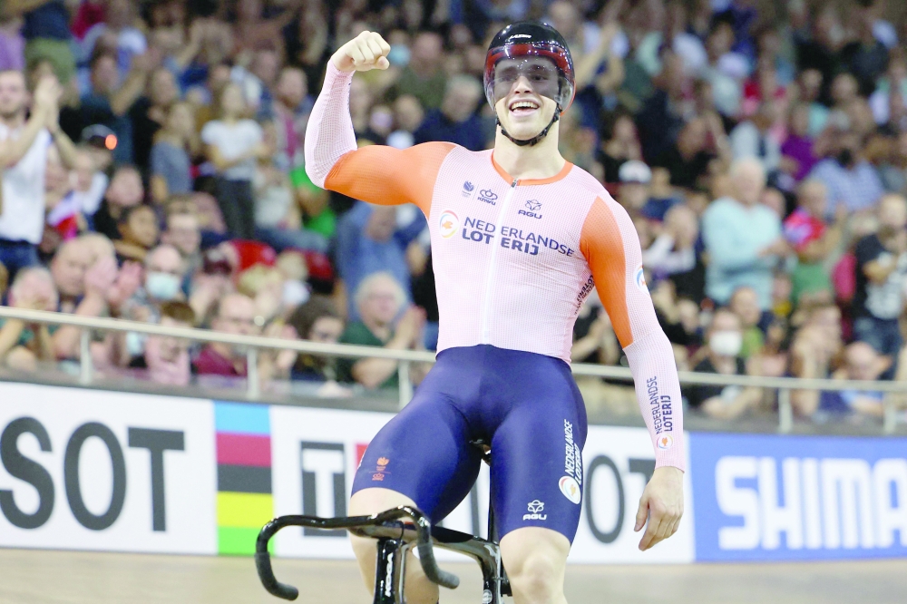 Netherlands' Harrie Lavreysen celebrates winning the Men's Sprint final during the UCI Track Cycling World Championships at the Velodrome of Saint-Quentin-en-Yvelines, southwest of Paris, on October 16, 2022.  (Photo by Thomas SAMSON / AFP)

